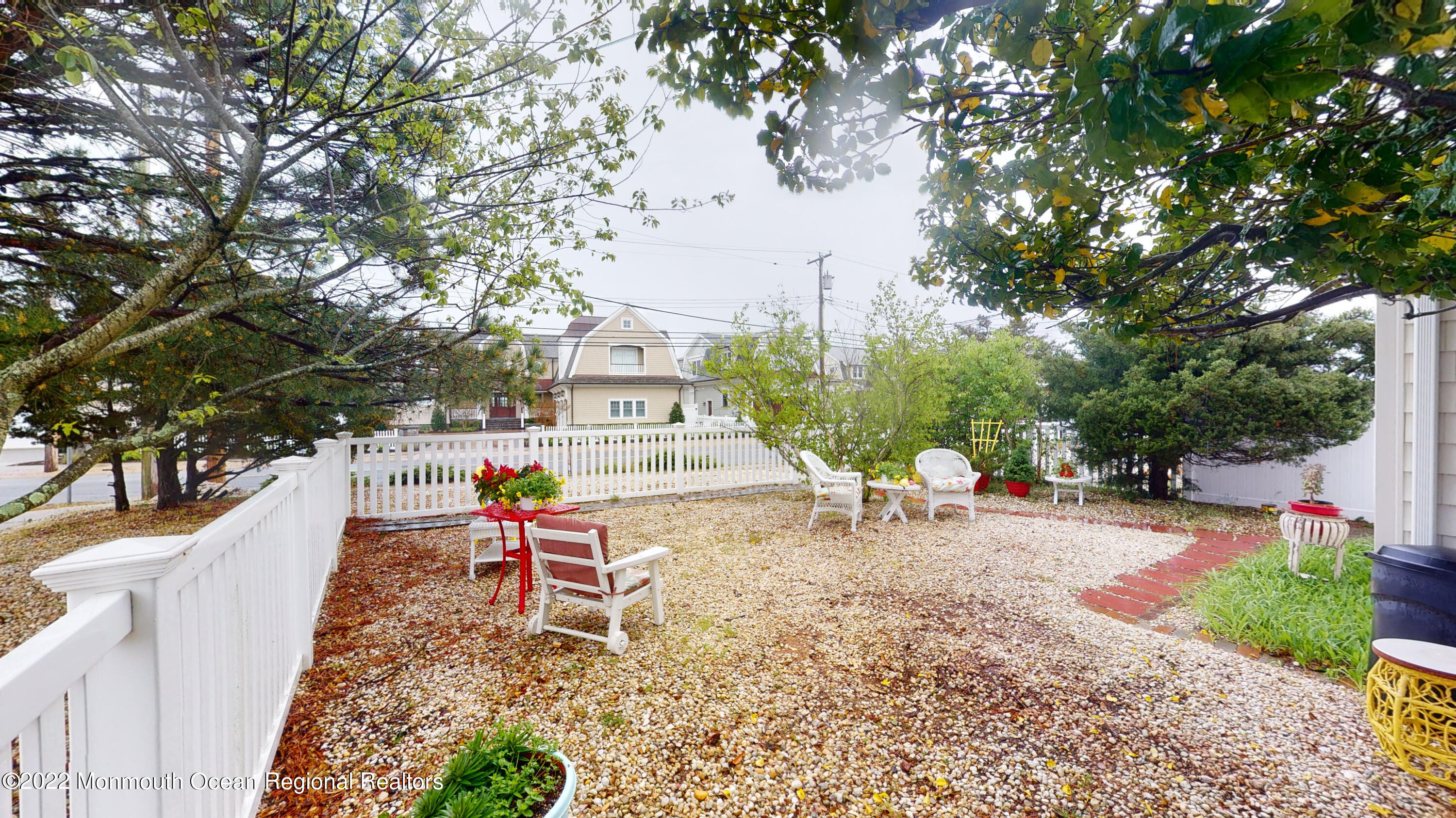 2 Funston Road Lavallette, NJ 08735 - Photo 21 of 24 a backyard of a house with table and chairs