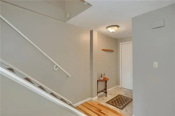 a kitchen with stainless steel appliances granite countertop a stove and a microwave