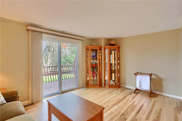 a view of a bedroom with furniture and window