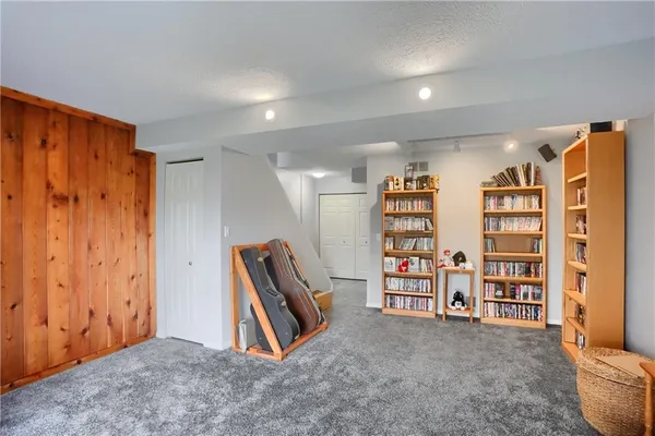 a view of an empty room with furniture and toys