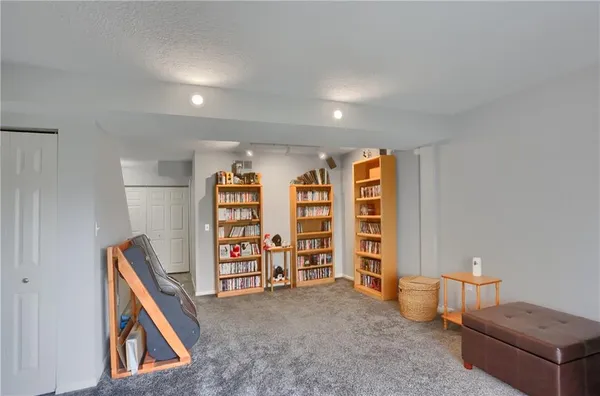 a hallway with front door wooden floor and closet