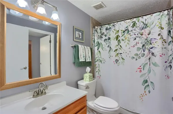 a bedroom with a bed and a closet