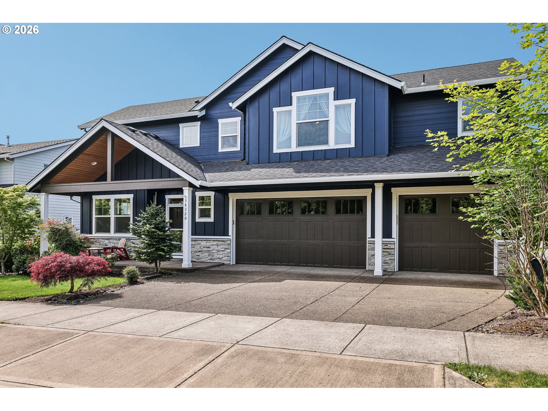 38320 Sequoia Street Sandy, OR 97055 - Photo 2 of 33 a front view of a house with a yard and potted plants