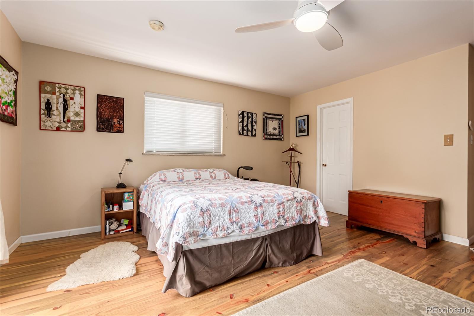 398 Leonards Road Boulder, CO 80302 - Photo 11 of 34 a bedroom with a bed and a chandelier