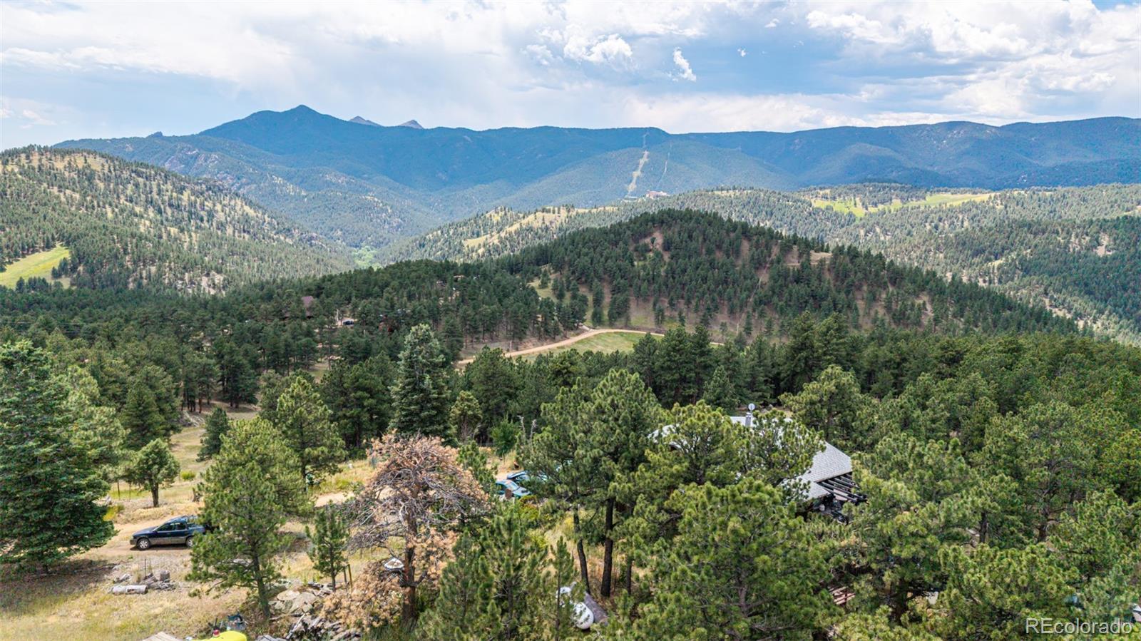 398 Leonards Road Boulder, CO 80302 - Photo 14 of 34 an aerial view of houses covered in trees
