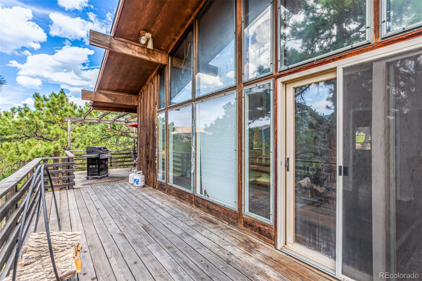 398 Leonards Road Boulder, CO 80302 - Photo 23 of 34 a view of a house with a porch