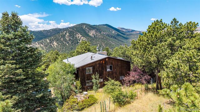 a view of balcony with wooden floor and potted plant