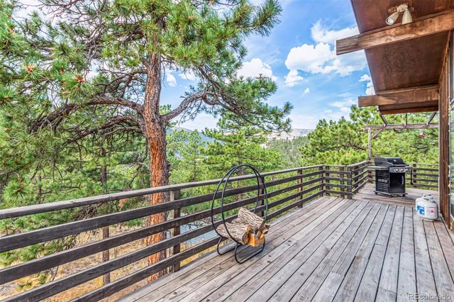 a view of balcony with wooden floor and outdoor space
