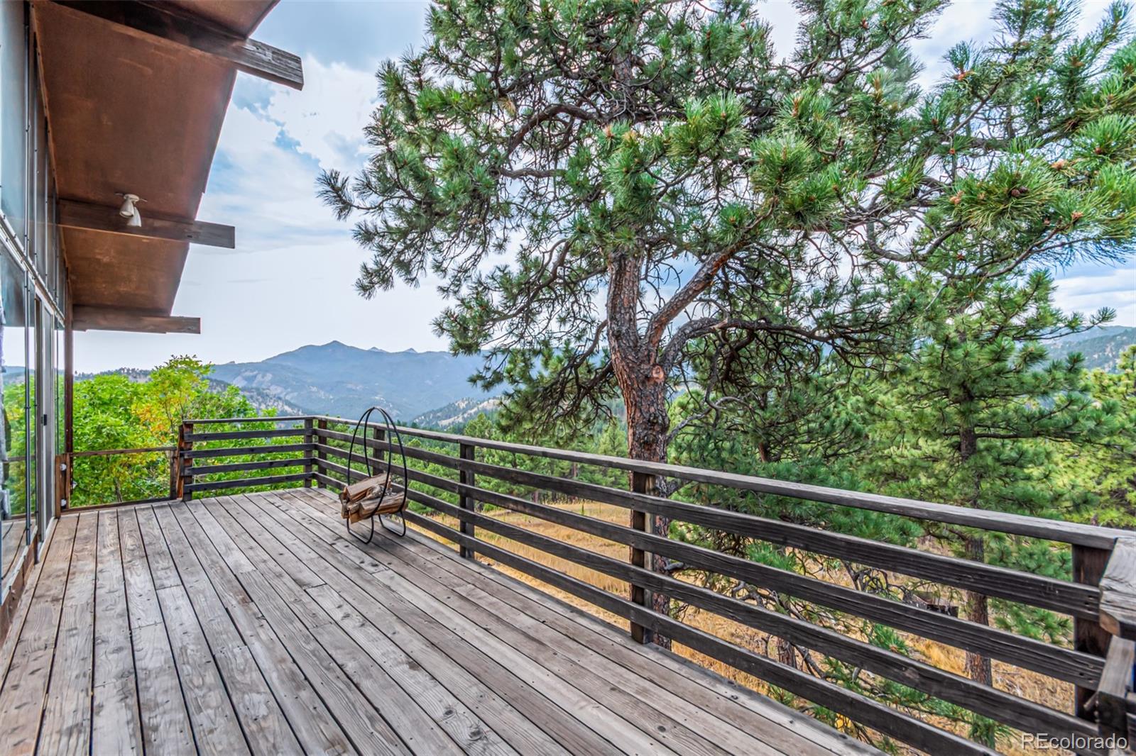 398 Leonards Road Boulder, CO 80302 - Photo 28 of 34 a view of balcony with wooden floor and outdoor space