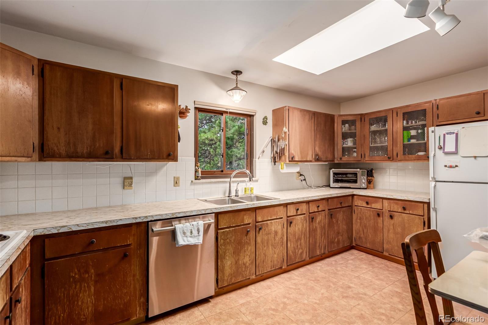 398 Leonards Road Boulder, CO 80302 - Photo 5 of 34 a kitchen with a sink and cabinets
