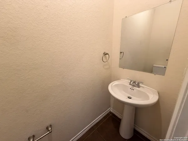 a bathroom with a sink and mirror