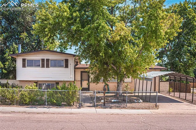 front view of a house with a garden