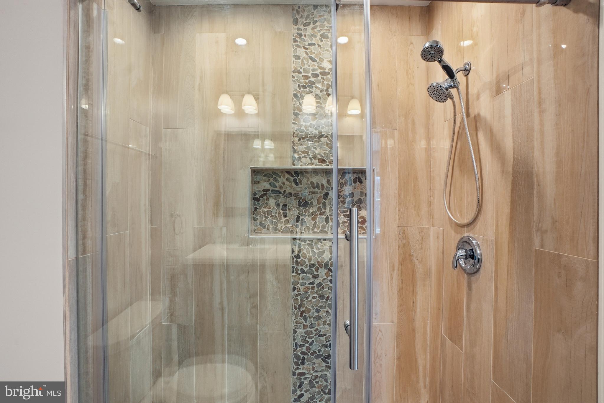 1118 Chicago Street Southeast Washington, DC 20020 - Photo 7 of 27 Sleek modern shower with elegant tiles.