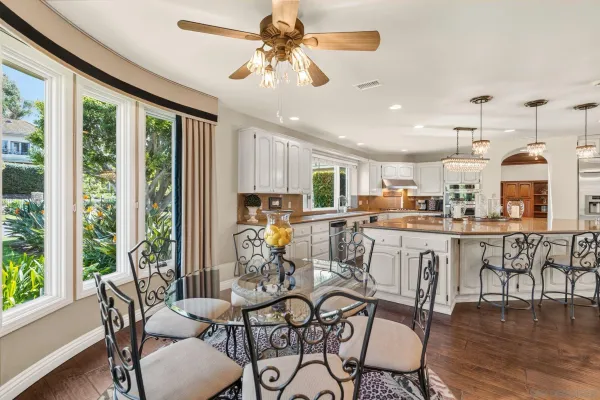 a view of a dining room with furniture window and outside view