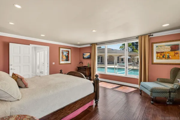 a bed room with a bed and a chair