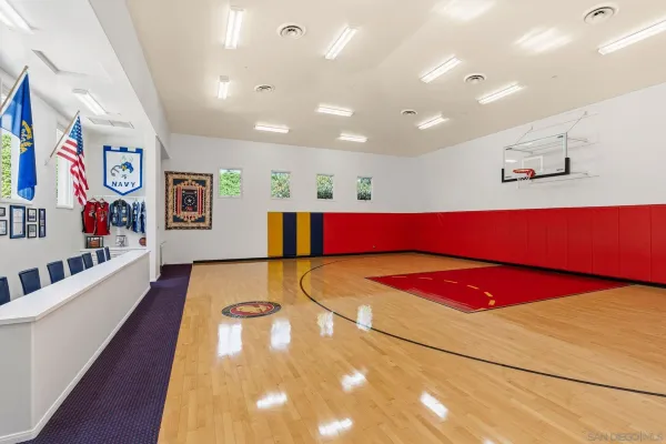 a street sign that is sitting in front of flowers