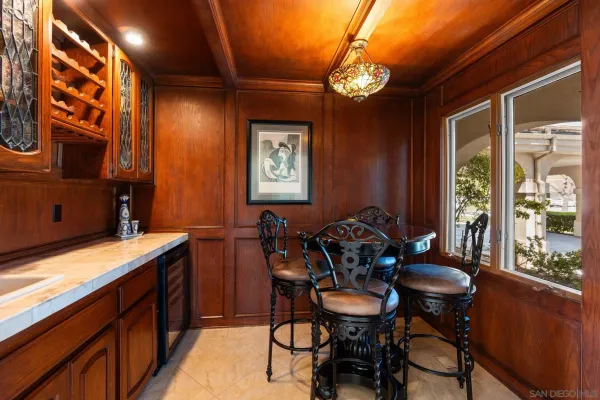 a view of a dining room with furniture and window