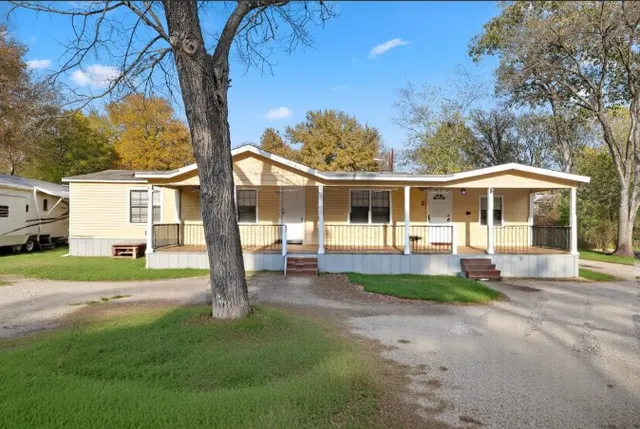 a view of a house with a yard