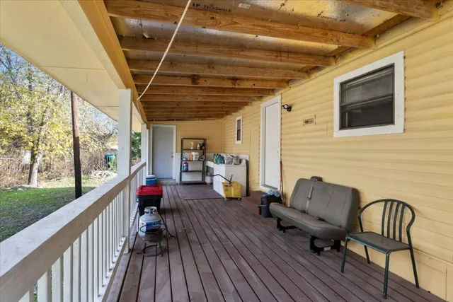 a view of a backyard with a tree