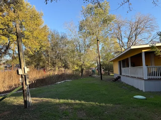 a view of a patio with table and chairs and wooden floor