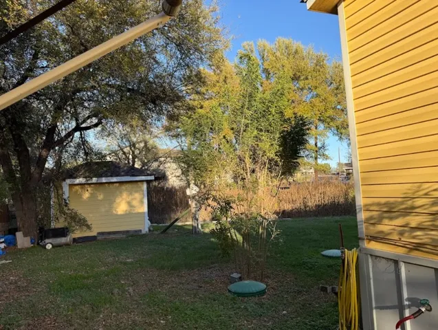 a kitchen with a dining table chairs and white cabinets