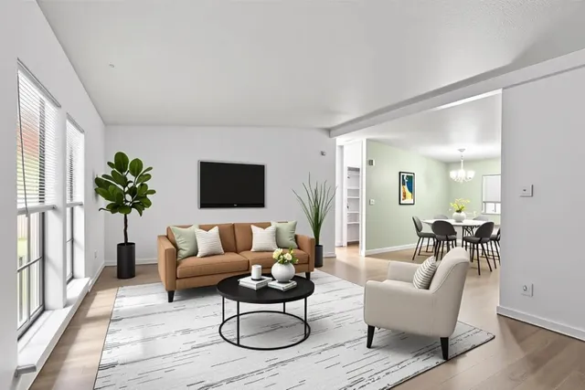 a bedroom with a bed and a wooden floor