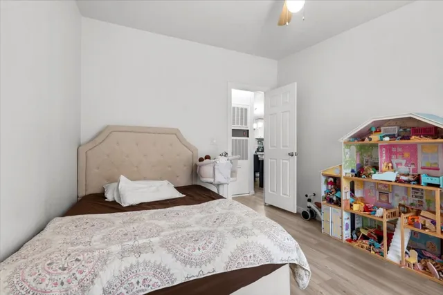 a bathroom with a double vanity sink toilet and shower