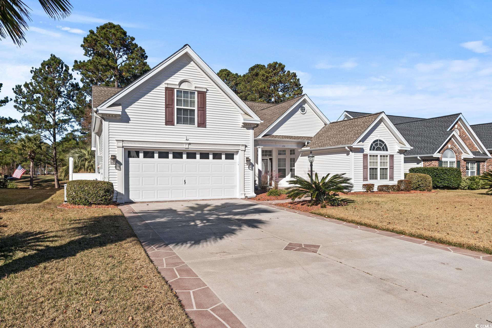 126 Pickering Drive Murrells Inlet, SC 29576 - Photo 2 of 40 View of property featuring a front yard and a gara