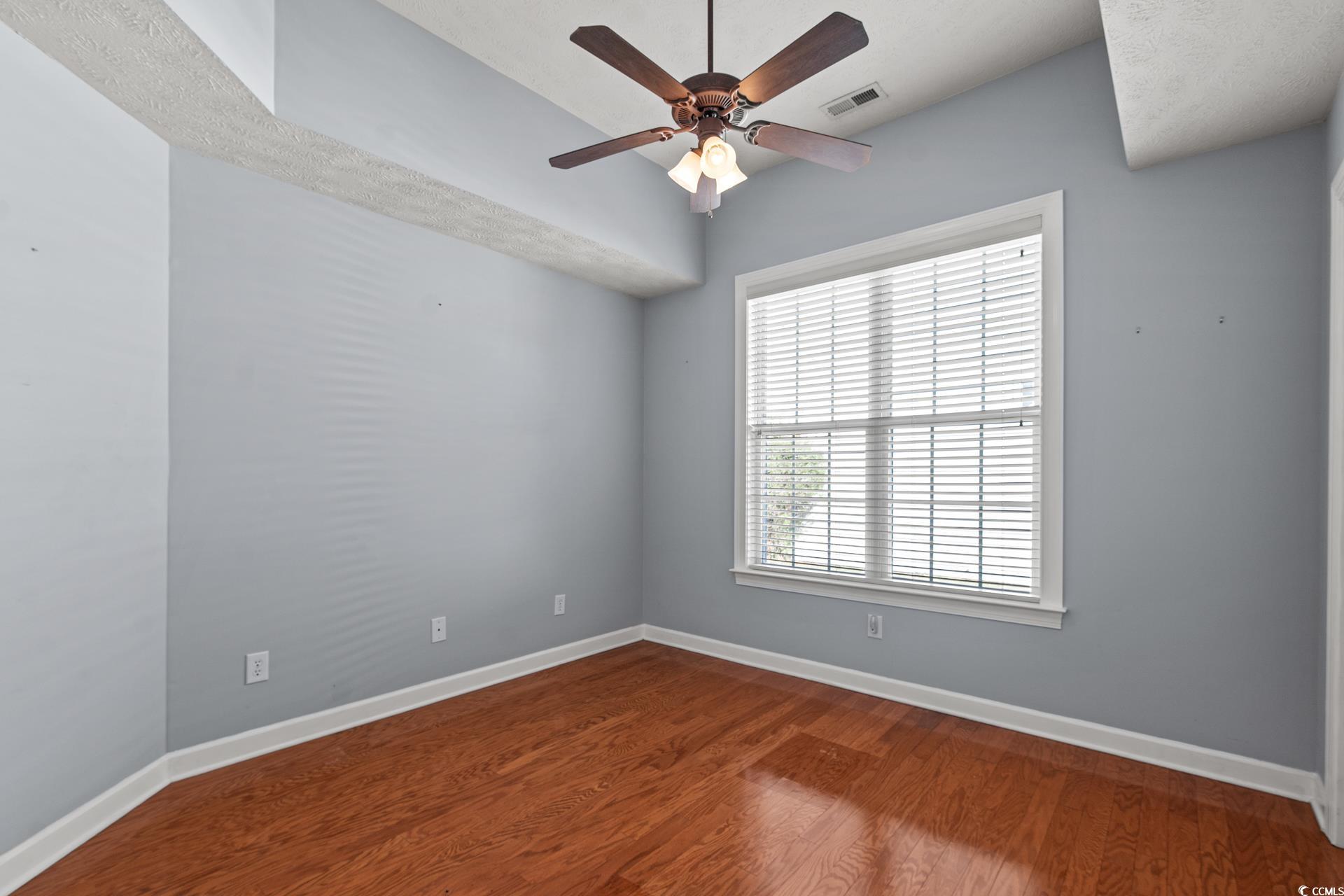 126 Pickering Drive Murrells Inlet, SC 29576 - Photo 22 of 40 Spare room featuring hardwood / wood-style floors,