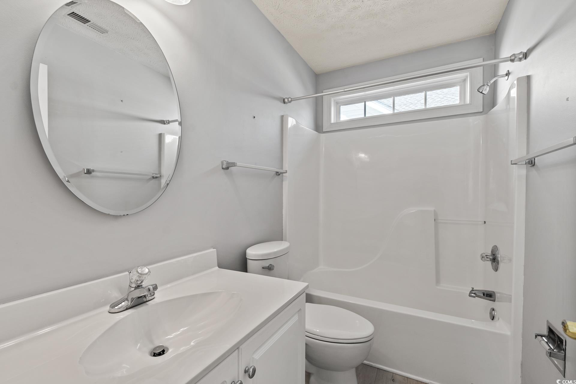 126 Pickering Drive Murrells Inlet, SC 29576 - Photo 28 of 40 Full bathroom with vanity, tub / shower combinatio