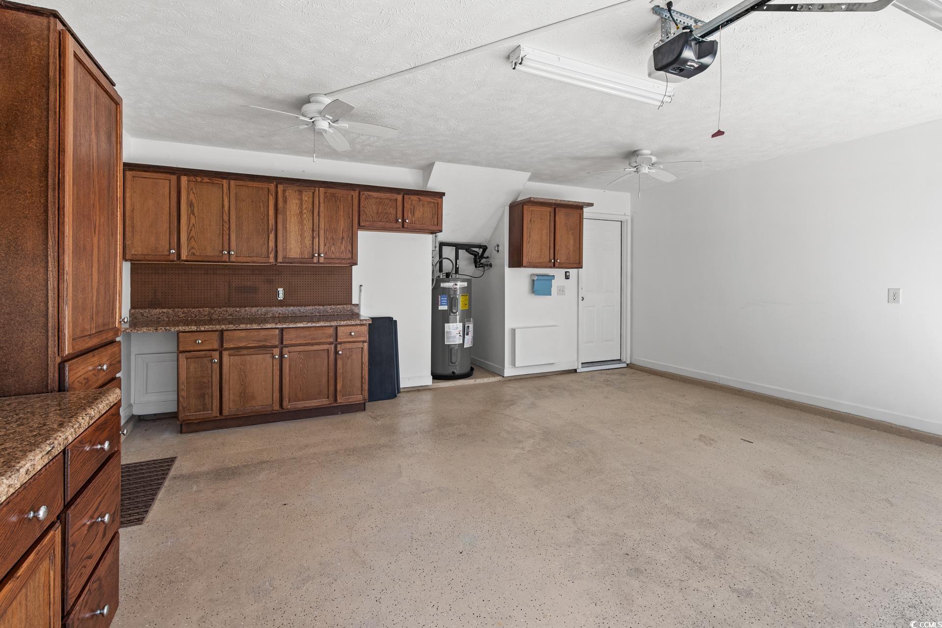 126 Pickering Drive Murrells Inlet, SC 29576 - Photo 36 of 40 Garage featuring electric water heater, a garage d