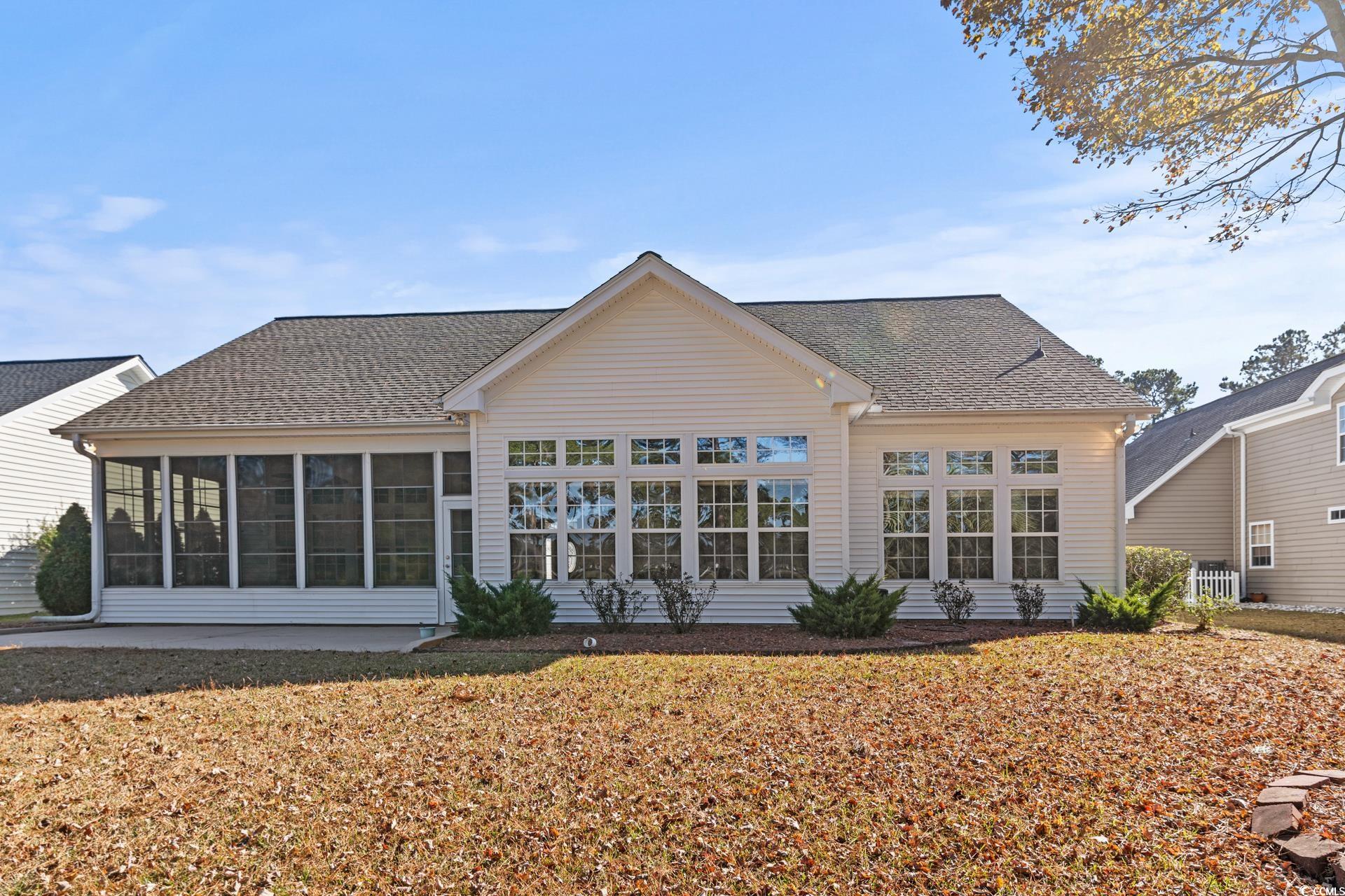 126 Pickering Drive Murrells Inlet, SC 29576 - Photo 40 of 40 Rear view of house with a sunroom and a yard