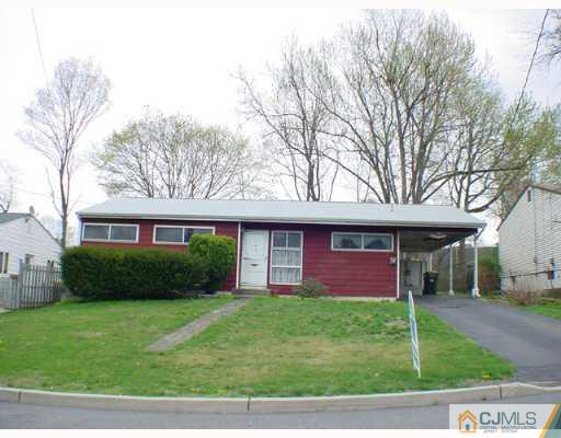 16 Rutgers Road Old Bridge, NJ 08859 - Photo 2 of 2 a view of a brick house with a yard potted plants and a large tree