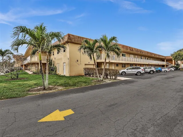 a swimming pool with outdoor seating and yard