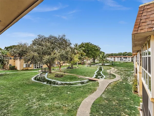 a view of a lake with a yard