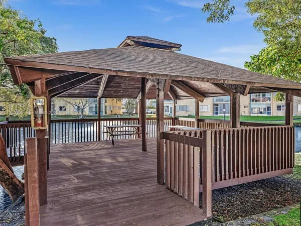 a view of a wooden deck and a yard