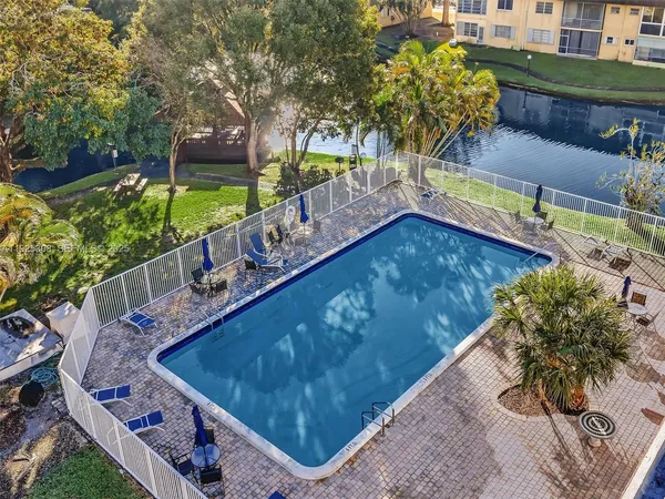 a view of a balcony with two chairs and a table