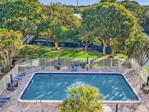 a view of a swimming pool with a patio