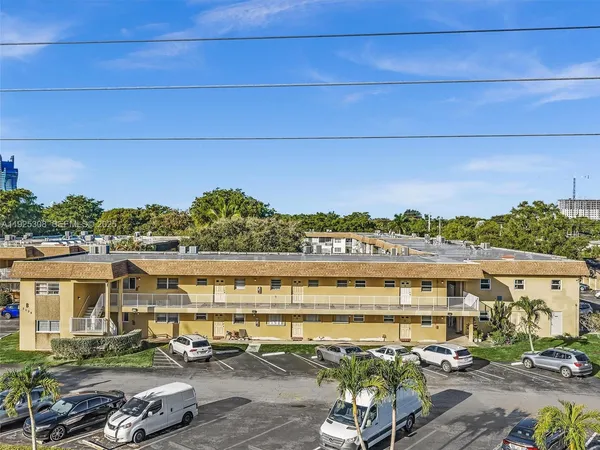 a view of a lake with a car parked in front of it