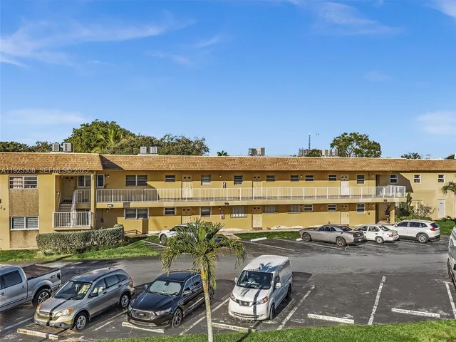 a view of a lake with couches and city view
