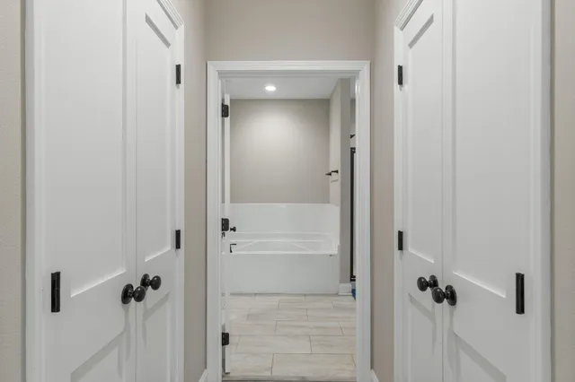 a bathroom with a glass shower door
