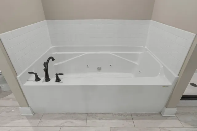 a close view of a bathtub in bathroom