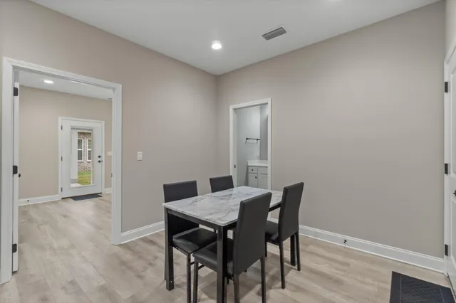 a workspace with furniture and wooden floor