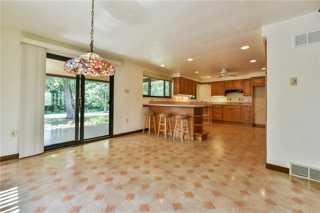 2337 Nicholson Road Franklin Park, PA 15143 - Photo 6 of 25 The light and bright dining area is open to the kitchen and steps out to the covered rear patio.
