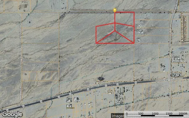 a view of a road with a mountain in the background