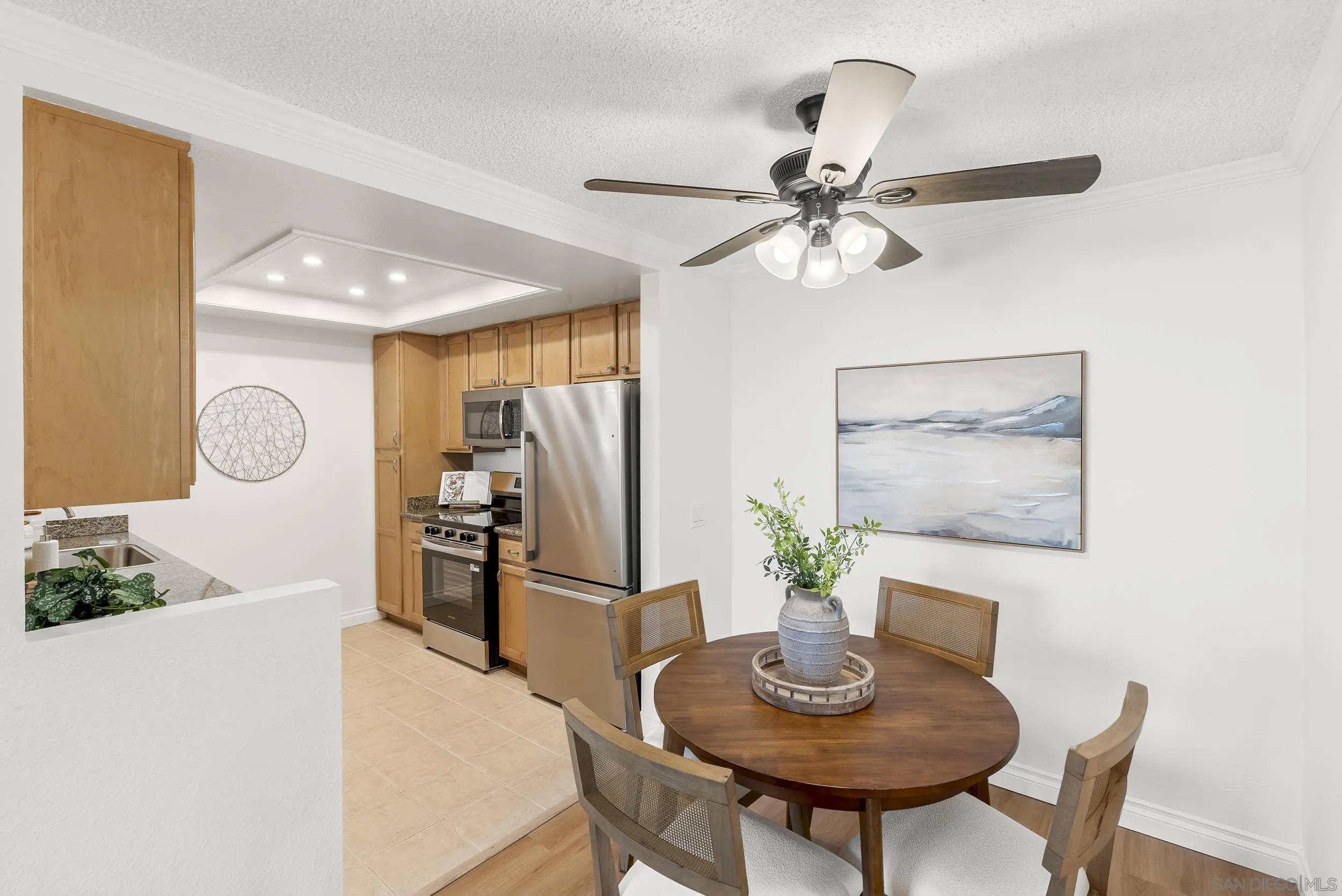 830 Broadway, Unit 15 El Cajon, CA 92021 - Photo 8 of 21 a view of a dining room with furniture and a chandelier