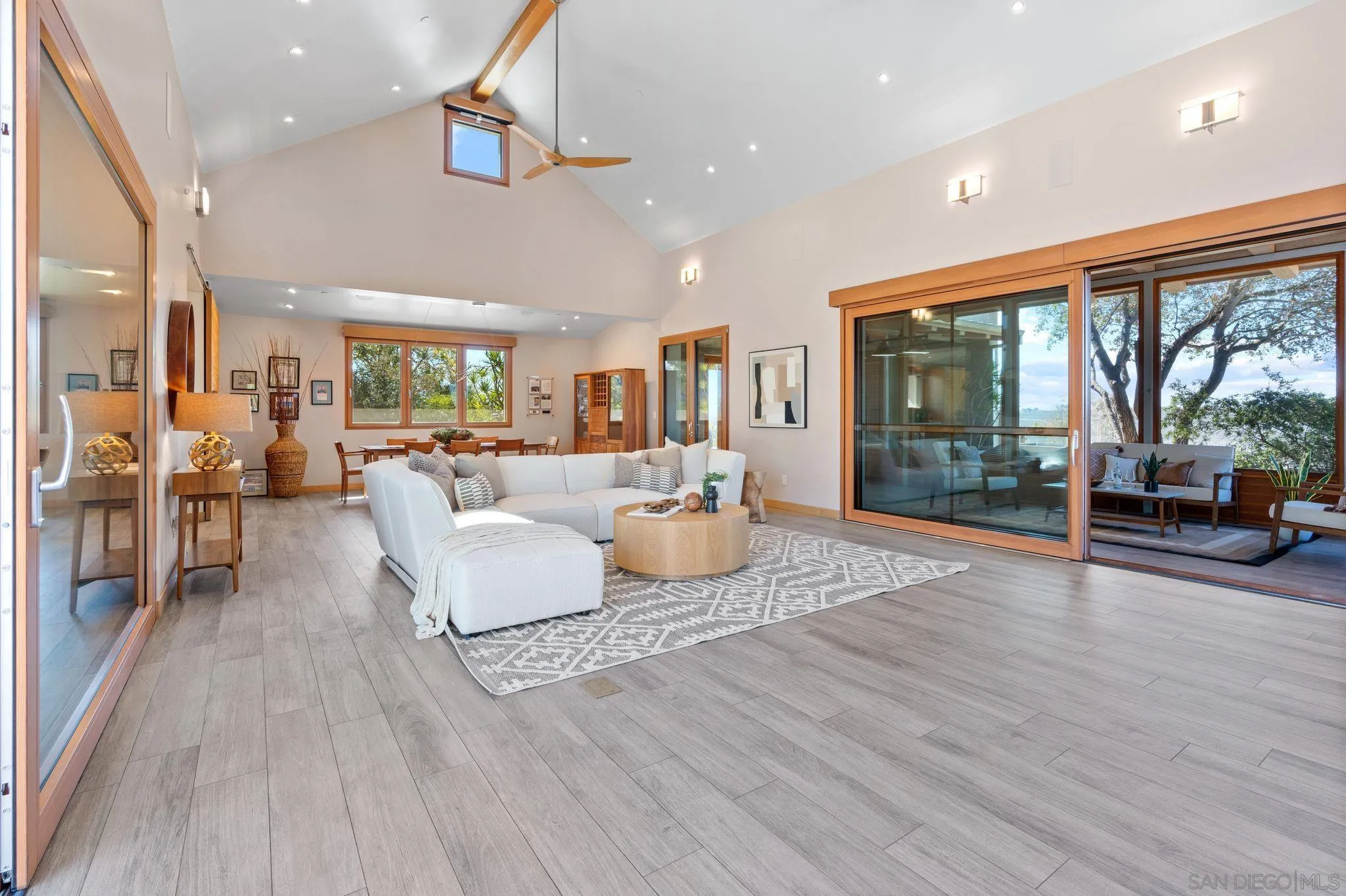 20385 Rancho Villa Road Ramona, CA 92065 - Photo 7 of 25 a living room with furniture a large window and wooden floor