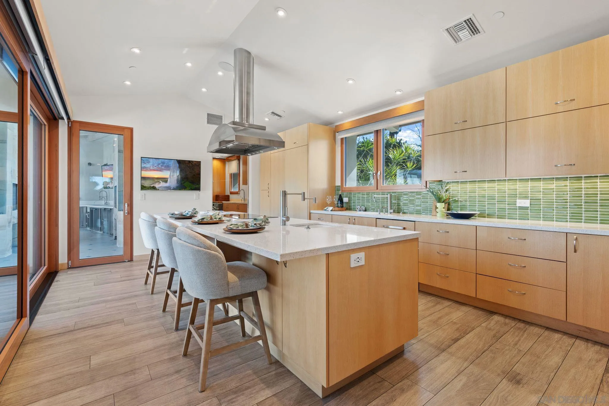 20385 Rancho Villa Road Ramona, CA 92065 - Photo 10 of 25 a kitchen with stainless steel appliances granite countertop a table chairs and a large window