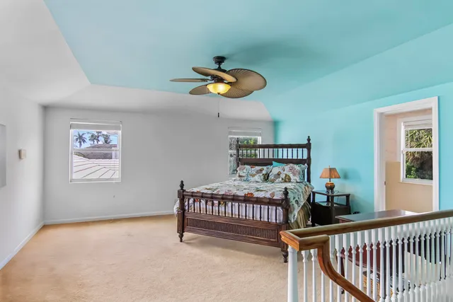 a bedroom with furniture and a window