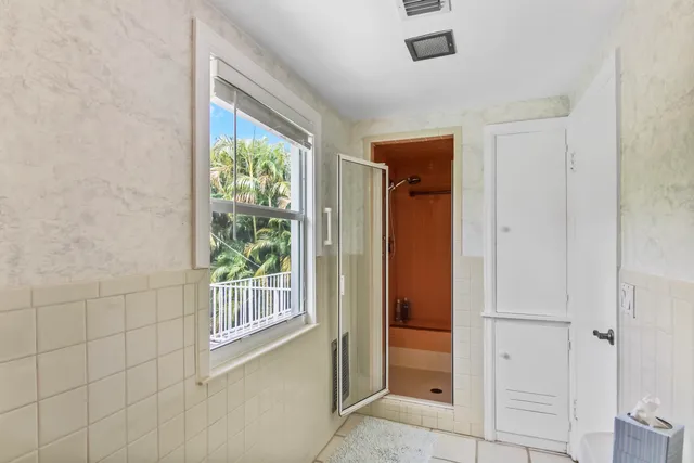 a view of an entryway with a floor to ceiling window